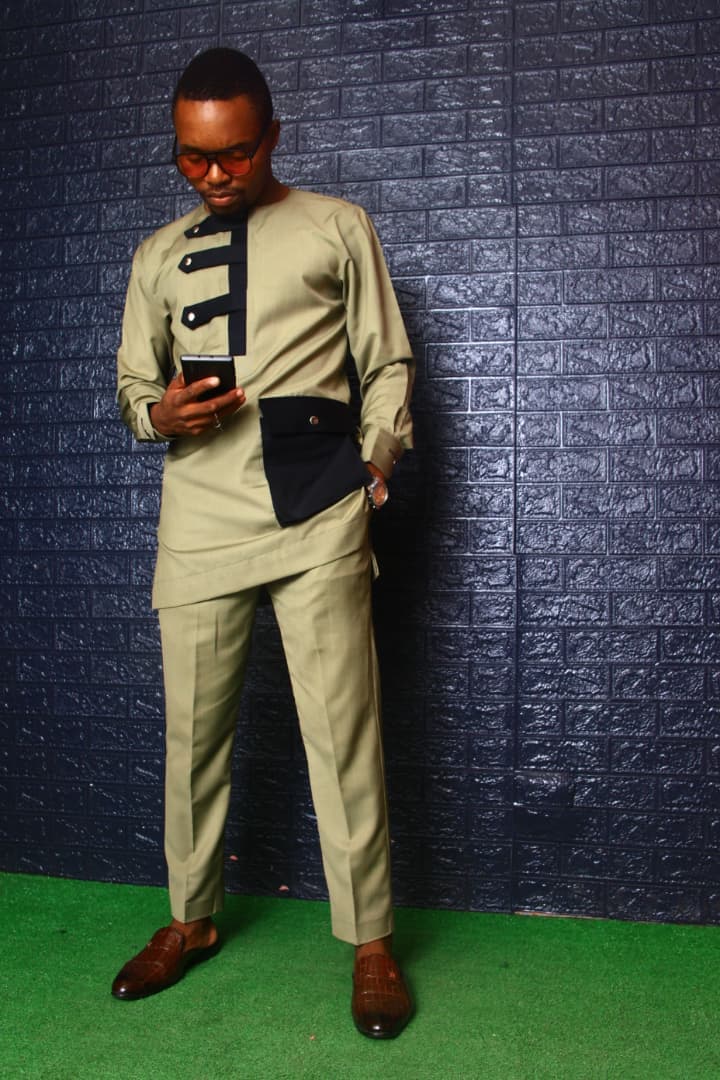 A casual-chic outfit featuring high-waisted trousers and a silk blouse.